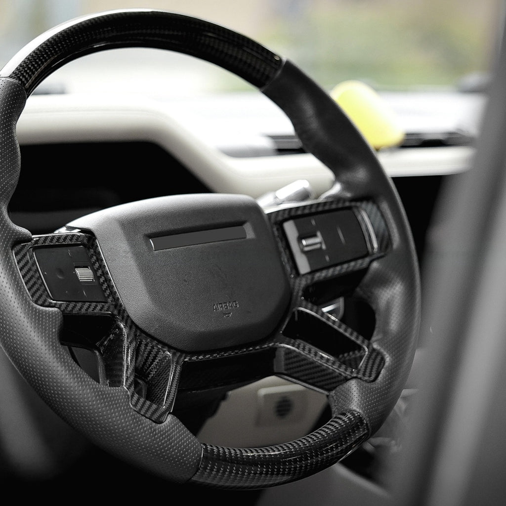 TITANSCHILD – Carbon Lenkradabdeckung für Defender 90/110/130 - Hauptbild